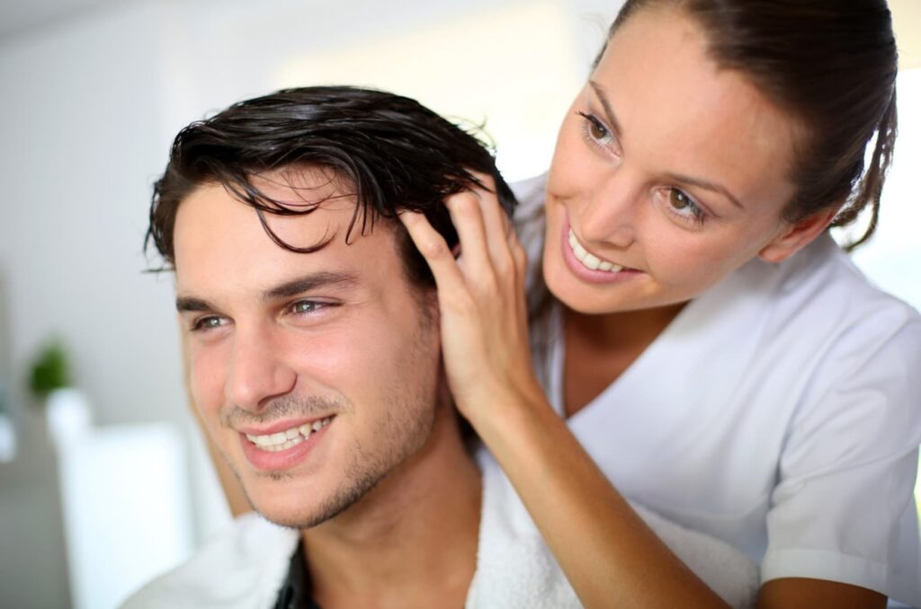 Couple with healthy skin and hair after successful treatments, smiling confidently